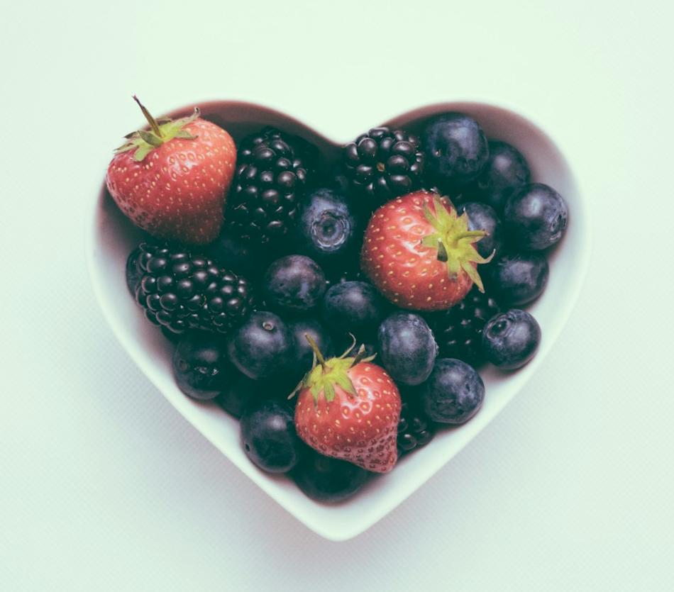 heart-shaped bowl with strawberries